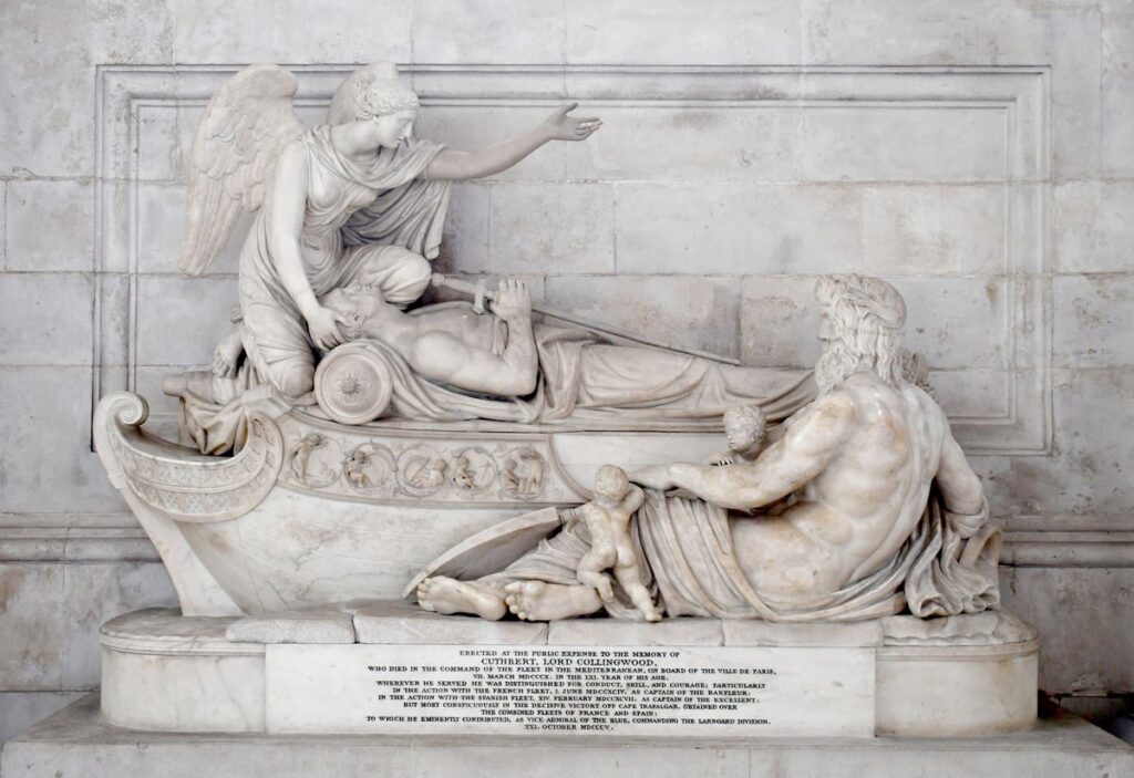 Marble monument showing recumbent figure with an angel at his head and a bearded figure representing the River Nile at his feet
