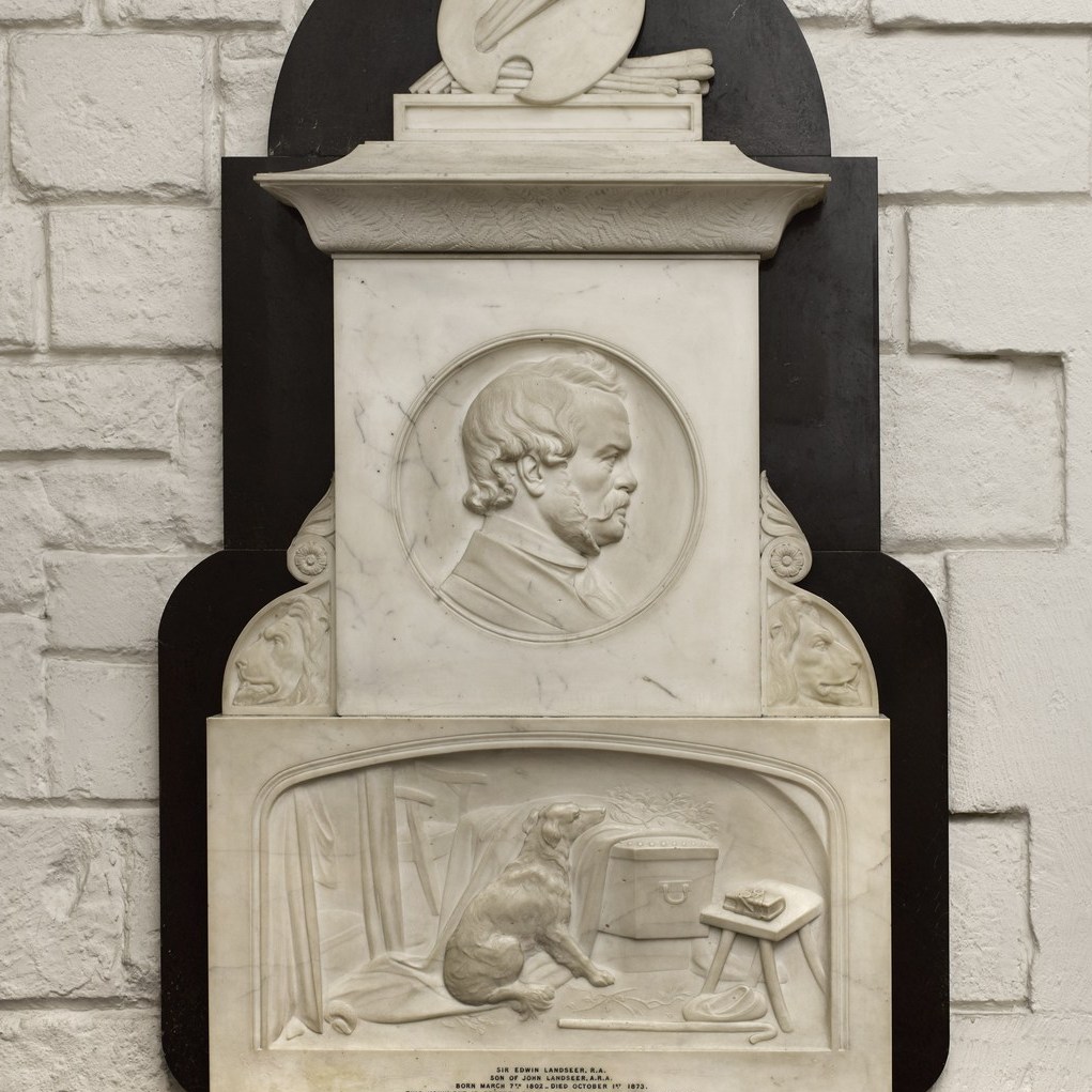 Part of a marble monument with portrait head in profile above and relief panel depicting dog leaning chin on a coffin, below