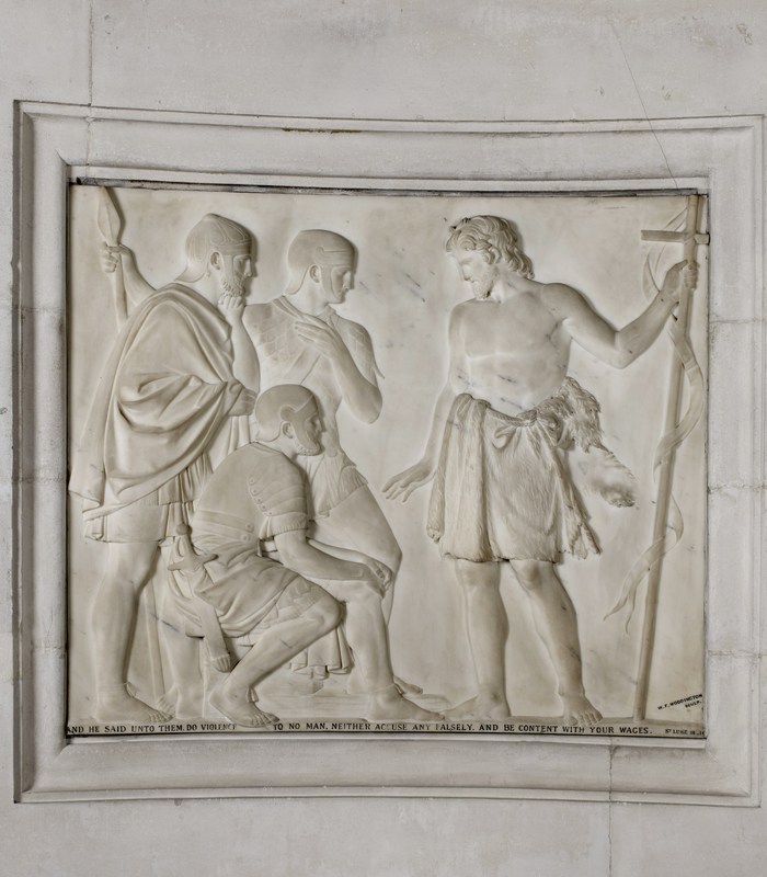 Marble relief panel showijg John the Baptist wearing a skin tunic and holding a staff, preaching to three Roman oldiers - two standing, one kneeling