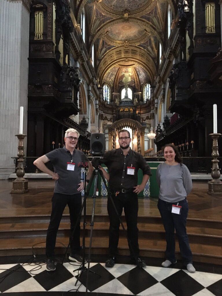 3 people standing in front of the East end of St Paul's cathedral