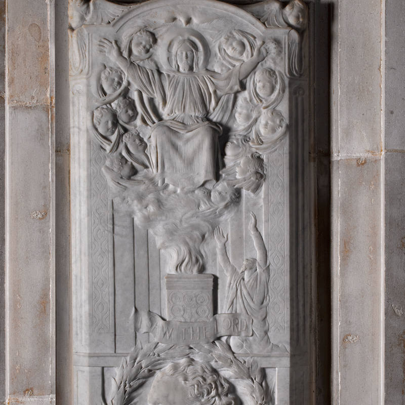 Relief sculpture detail showing Marble wall monument showing Christ enthroned surrounded by cherubim